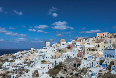 High angle view of town against cloudy sky