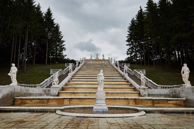 Gazebo by trees against sky