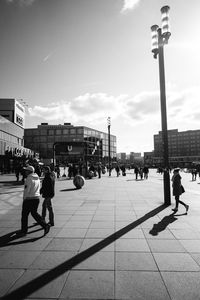 People walking on street in city