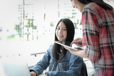 Young woman using mobile phone
