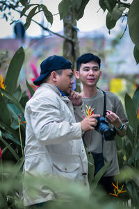 Portrait of smiling couple standing in park