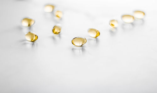 Close-up of pills on white background