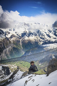 Scenic view of snowcapped mountains against sky