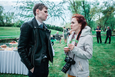 Young couple standing in park