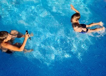 High angle view of people swimming in pool