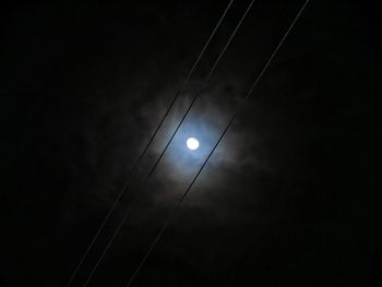 Low angle view of moon in sky at night