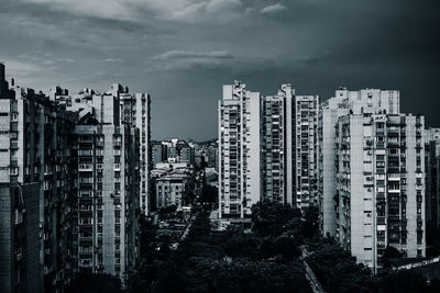 Buildings in city against sky