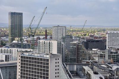 Modern buildings in city against sky