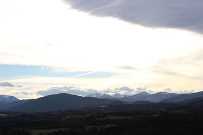 Scenic view of silhouette mountains against sky during sunset