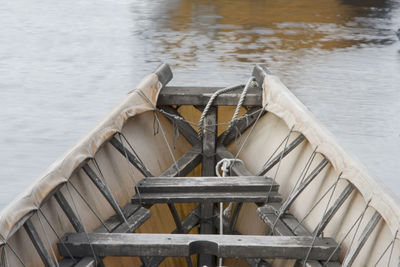 High angle view of old boat bow floating in lake