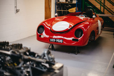 Close-up of red car on white background