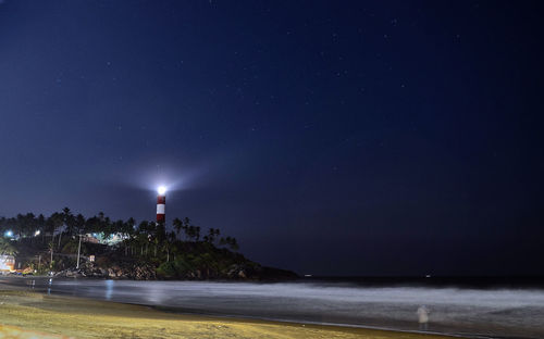 Scenic view of sea against clear sky at night