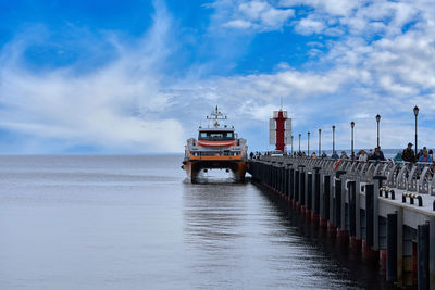 Pier on sea against sky