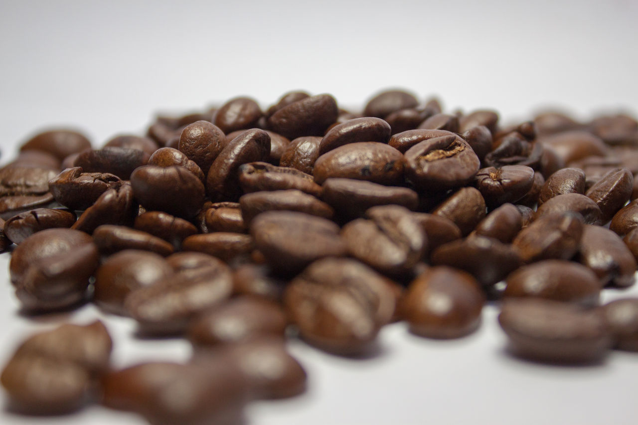 CLOSE-UP OF COFFEE BEANS IN GLASS