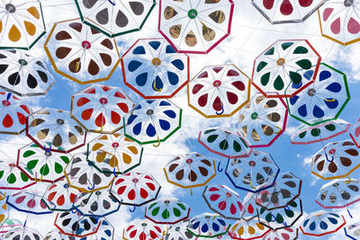 Full frame shot of multi colored umbrellas against sky