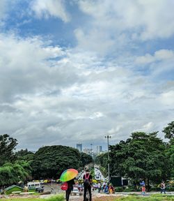 People on street against sky