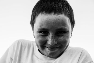 Freckled little boy smiling