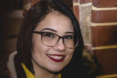Portrait of smiling woman at home