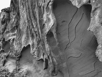 Black and white close up of sandstone rock formation outer layer decay
