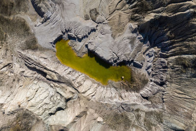 Abandoned industrial mining area. opencast mine filled with water. aerial shot of artificial lake