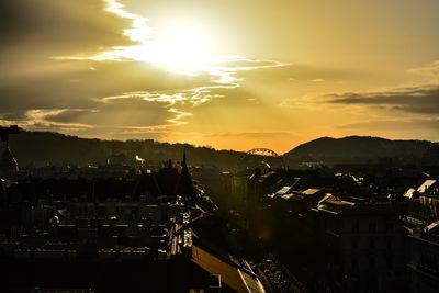 High angle view of buildings against sky during sunset