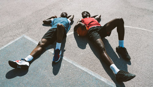 Low section of people walking on road