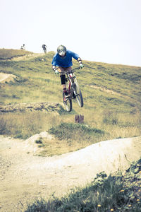 Man riding bicycle on road