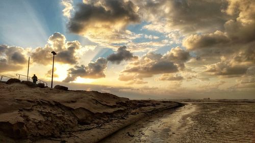 Panoramic view of road against sky during sunset