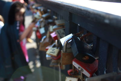 Close-up of padlocks on railing