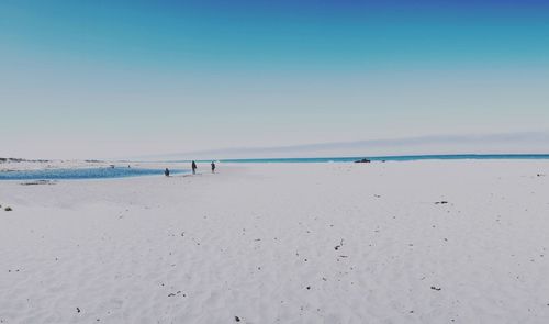 Scenic view of beach against clear sky