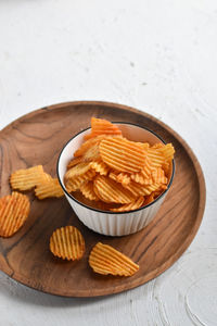 High angle view of potato chips in plate on table