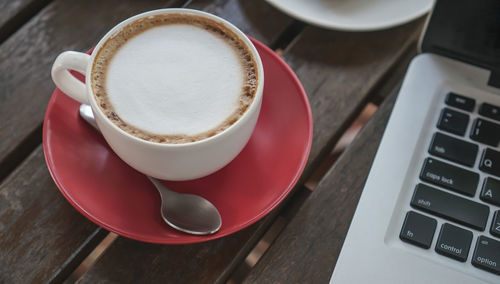 High angle view of coffee cup on table