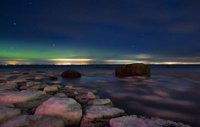 Scenic view of sea against sky at night