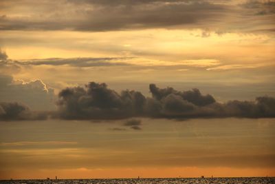 Scenic view of dramatic sky over sea during sunset