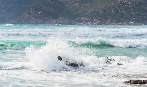 Waves splashing on shore