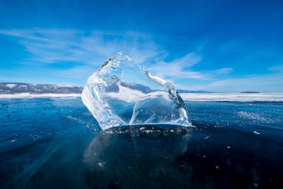 Surface level of frozen sea against sky