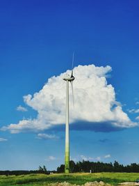 Low angle view of windmill against sky