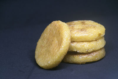 Close-up of bread against black background