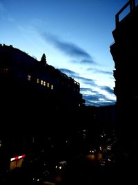 Silhouette city against sky