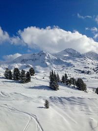 Scenic view of snow mountains against sky