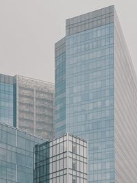 Low angle view of modern buildings against clear sky