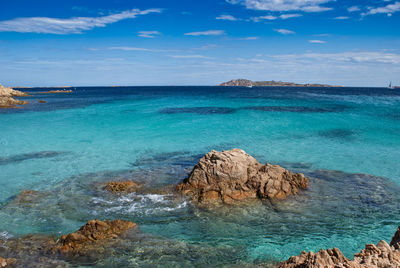 Scenic view of sea against blue sky