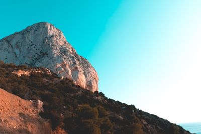 Low angle view of rock formation against sky