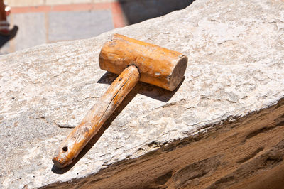 Close-up of hammer on rock