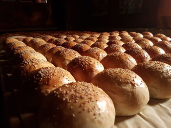 Close-up of bread arranged on table in bakery