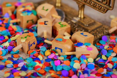 Close-up of colorful confetti on table during hanukkah