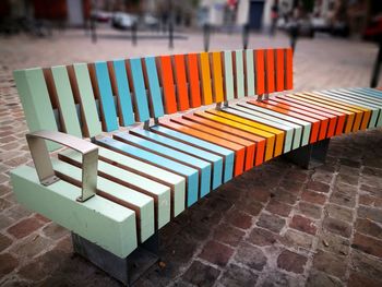 Empty benches on footpath