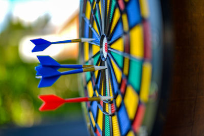 Close-up of multi colored tied to metal