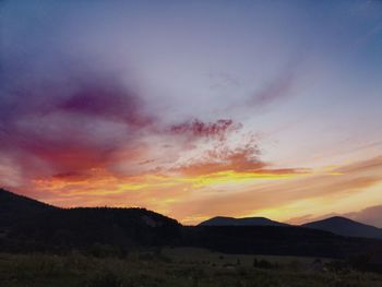 Scenic view of silhouette landscape against sky during sunset