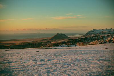 Scenic view of landscape against sky during winter